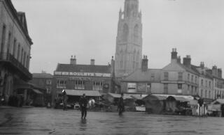 A view of the Marketplace showing the 'Rum Puncheon' tavern and the spire of St Botolph's Church.