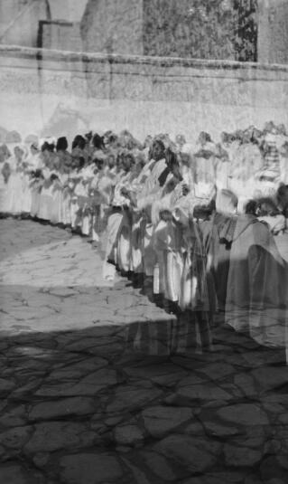 Two views of a Berber Dance troupe, one superimposed on the other, probably as a result of forgetting to wind the film on. Telouet, 13th January 1936.