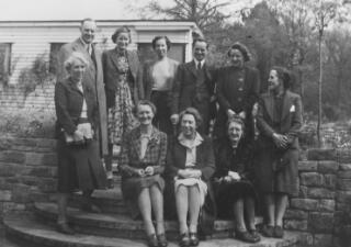 Group portrait taken outdoors of Lloyd George's staff including A J Sylvester and Frances Stevenson.