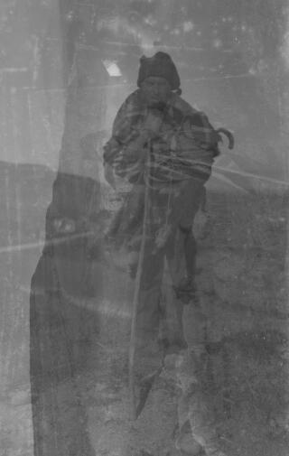 Two shots, one of a shepherd, the other a landscape, one superimposed on the other, presumably due to not winding the film on after the first exposure.