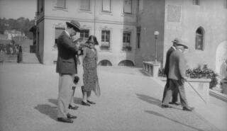 David and Margaret Lloyd George along with others walking towards the Chateau Sainte-Maire, Lausanne.