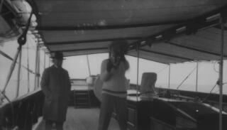 The two Lloyd Georges on deck, but under an awning aboard the 'Sabrina'. Gwilym is amusing himself with a punchbag.