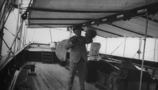 David Lloyd George amusing himself with a punchbag.