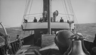 Looking from the bows towards the bridge of 'Sabrina.' Various members of the Lloyd George party are to be seen on deck.