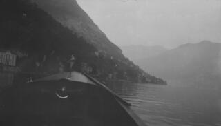 Photo taken on board a motor launch on Lugano. The bow of the boat is in the foreground, but out of focus.