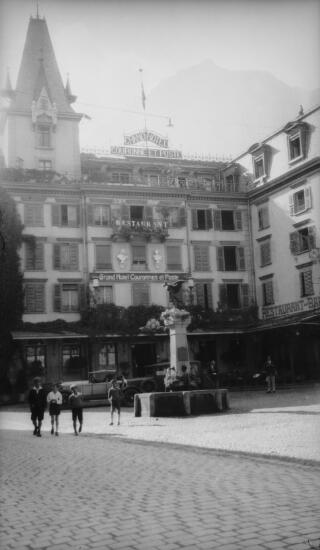 Exterior of the Grand Hotel Couronnes et Poste, Place St Sebastien, Brigue also showing the Chavez memorial in the foreground.