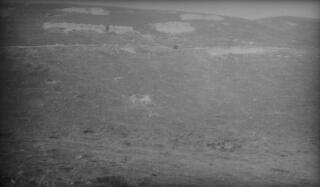 A hillside with a sheepwalk or track near the summit. Location unknown.