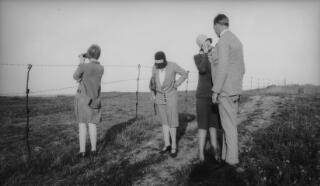 Gwilym Lloyd George, his wife, sister Megan and Mrs Sylvester viewing a WW1 battlefield. Taken at same location as PZ7890/64.
