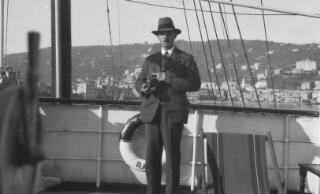 Detective Pavey, with camera, aboard 'Sabrina' at Santa Margherita Ligure.