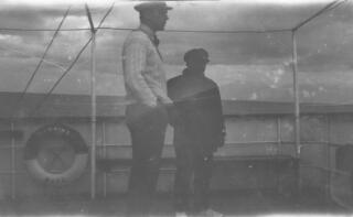 Gwilym Lloyd George ( in white cricketing sweater) in conversation with the skipper on the deck of "Sabrina"