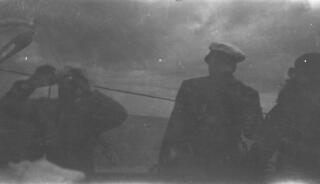 David Lloyd George (left) and Gwilym (with back to camera) aboard "Sabrina". Image underexposed.